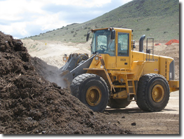 Loading out of a stockpile of ground greenwaste